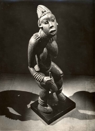 Man Ray. Untitled (Bamileke figure, njuindem, “Bangwa Queen,” Bangwa Kingdom, Cameroon), c. 1934. Gelatin silver print. Private collection, Paris. © 2009 Man Ray Trust / Artists Rights Society (ARS), NY / ADAGP, Paris