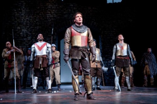 Michael Hayden as King Henry V in foreground, with the cast of the Shakespeare Theatre Company’s production of William Shakespeare’s Henry V, directed by David Muse.  Photo by Scott Suchman.