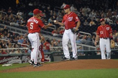 Manager Jim Riggleman takes the ball from Jason Marquis