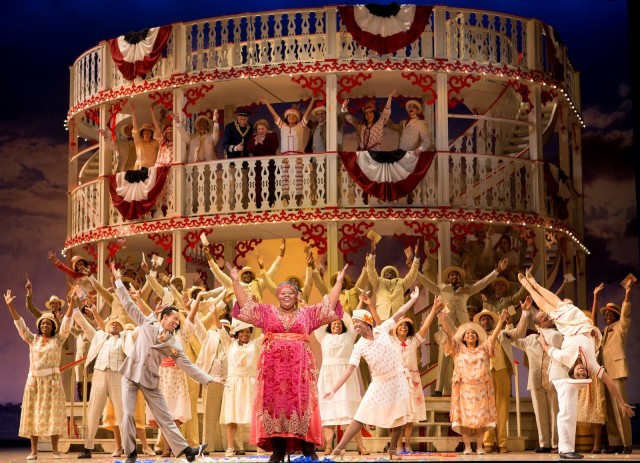 Angela Renée Simpson as Queenie (center, in pink dress) and the company of Show Boat. Photo by Scott Suchman.